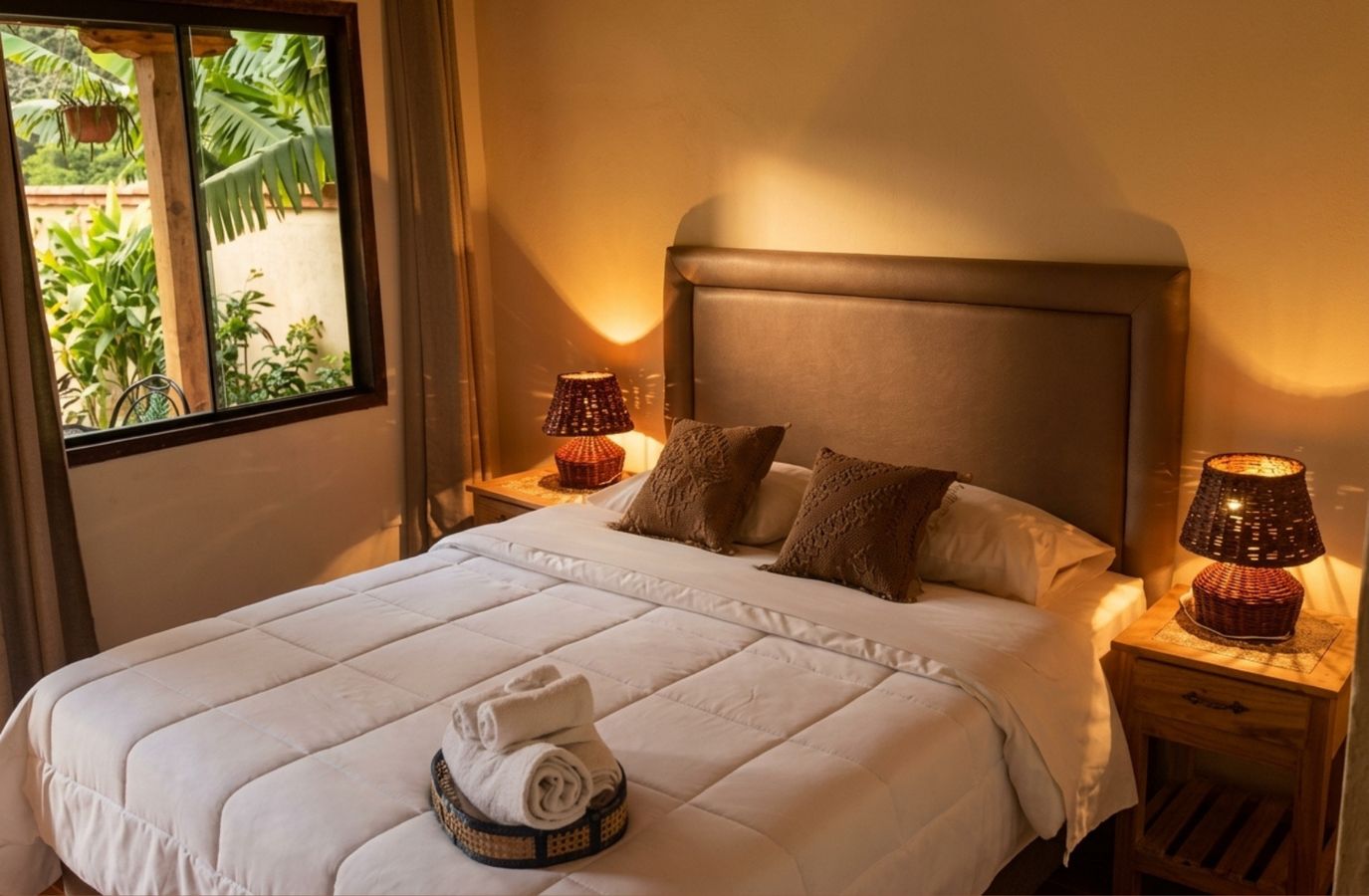 Room with upholstered headboard and garden view