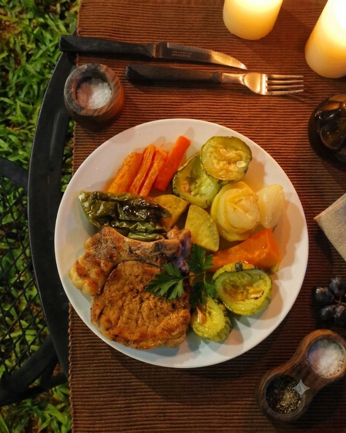 Dinner served outdoors, main course with grilled vegetables