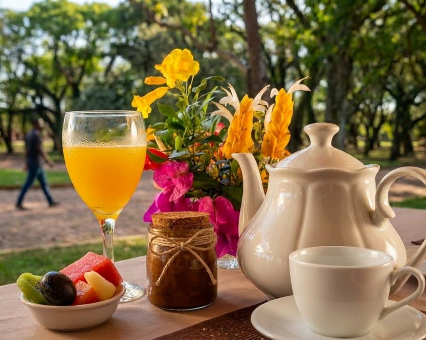 Glass of juice, homemade jam and porcelain teapot